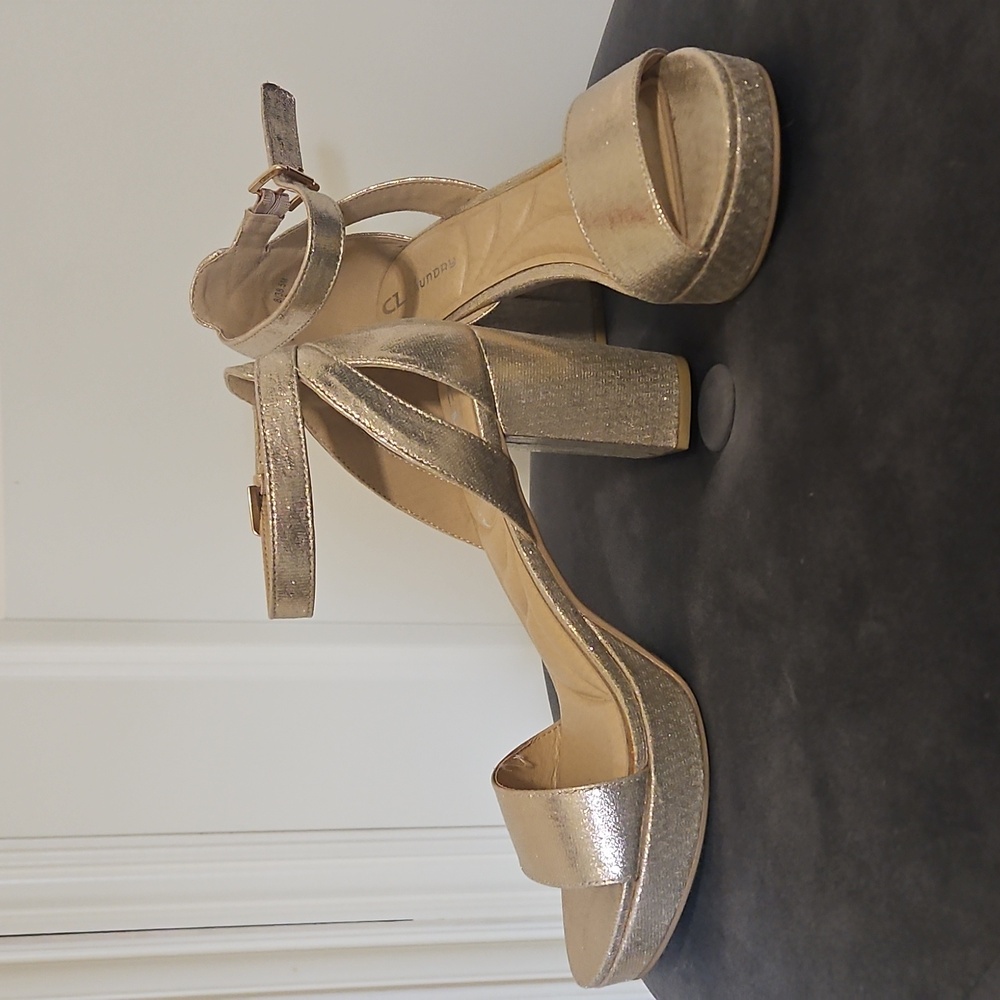 Gold high heels by CL
